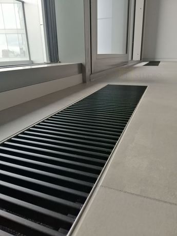 Установка черных решеток для коневкторов отопления в ЖК Taryan Towers
